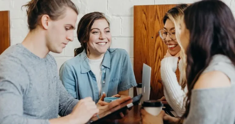 Team members in a collaborative meeting exploring how contest software influences customer engagement and interaction